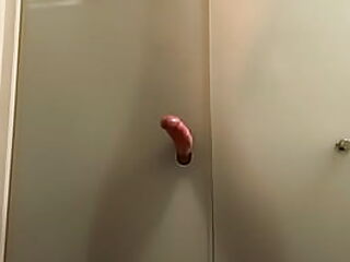 Gay men reach orgasm through glory hole, creating a steamy, cum-filled climax.